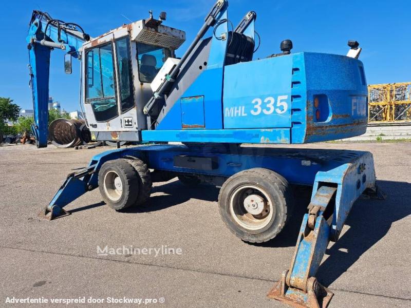 Photo Fuchs MHL335 + Grapple + Reman Engine  image 1/17