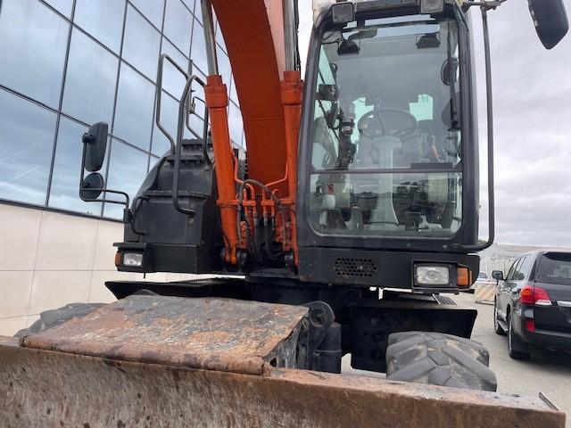 Pelle Hitachi ZX140W-5B Pelle sur pneus