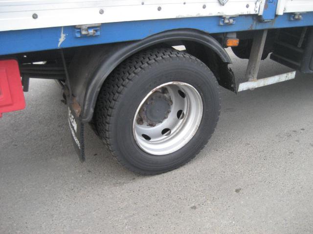 Camion Renault Midlum 180 Savoyarde (plateau ridelles bâché)