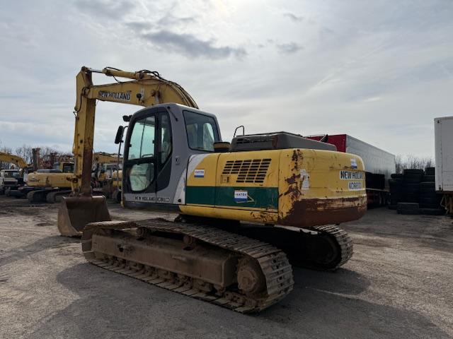 Pelle New Holland E 215 Pelle sur chenilles